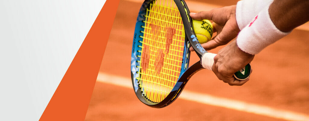 Hands of a Tennis Player Preparing to Serve