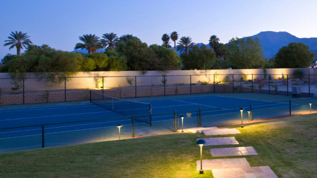 Tennis Court in the Evening with Lights Turned on