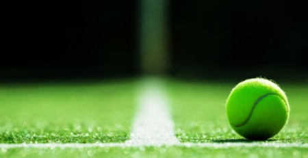 Tennis ball on artificial grass