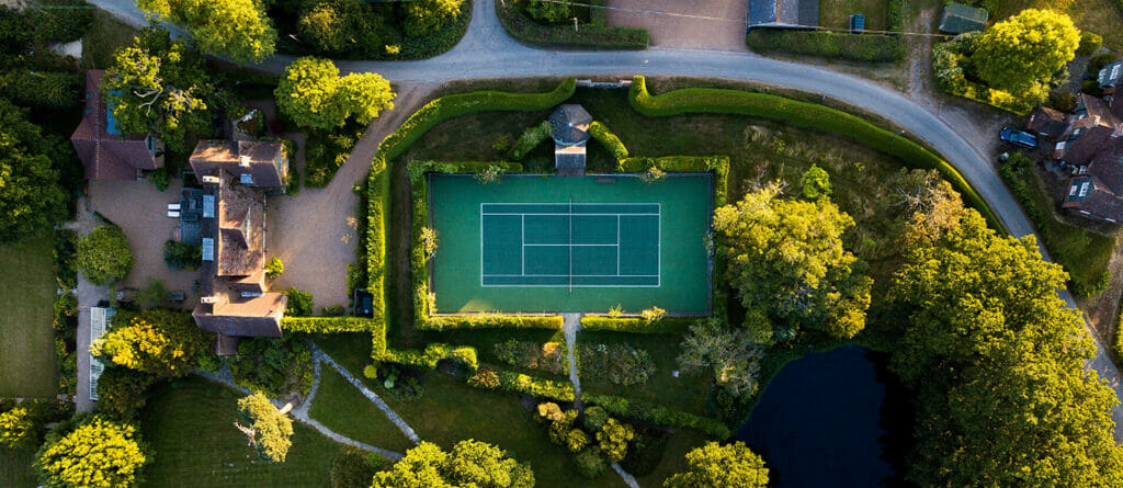 A Drone Looking Down at an Outdoor Artificial Grass Tennis Court