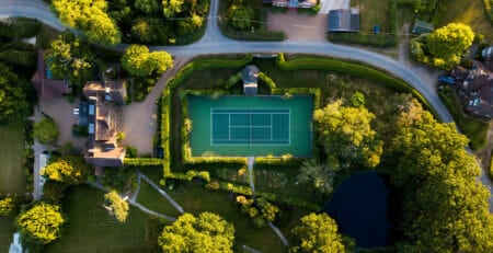 A Drone Looking Down at an Outdoor Artificial Grass Tennis Court