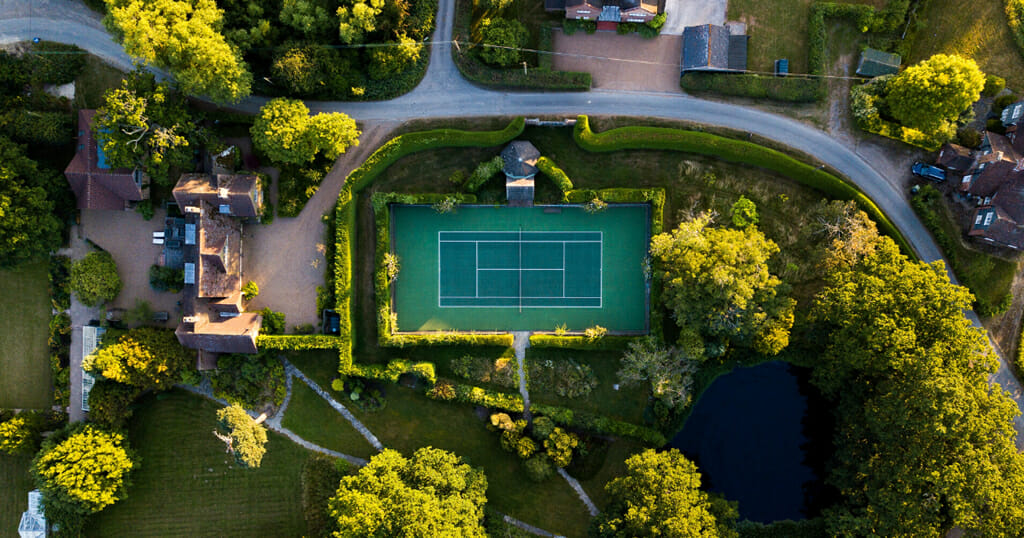 A Drone Looking Down at an Outdoor Artificial Grass Tennis Court