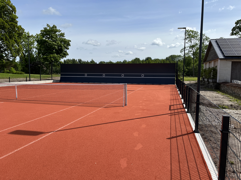 Tennis Court Fence Set 2D-656 Elite - Half Field View with Full Size Practice Wall Installed Opposite of Back Run-Off Area